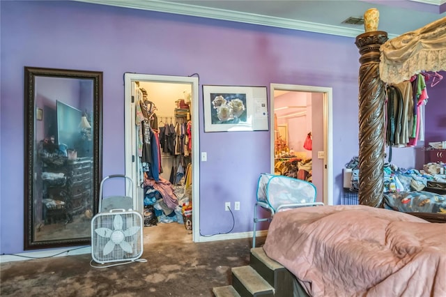 1902 Griffins Green Dr, Bartow, FL 33830 - bedroom with a walk in closet, a closet, ornamental molding, and carpet flooring