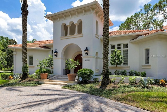 6186 Louise Cove Dr, Windermere, FL 34786 - view of front of property featuring a tiled roof and stucco siding