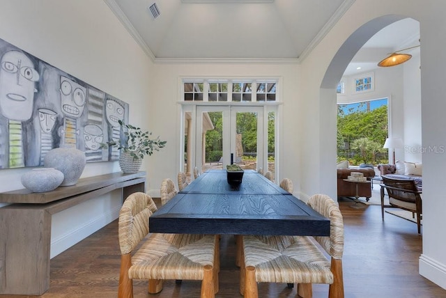 6186 Louise Cove Dr, Windermere, FL 34786 - dining area with french doors, high vaulted ceiling, arched walkways, wood finished floors, and ornamental molding