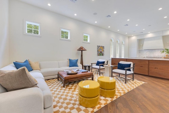 6186 Louise Cove Dr, Windermere, FL 34786 - living area featuring healthy amount of natural light, light wood finished floors, and recessed lighting