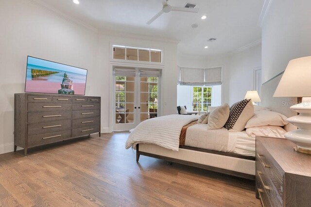 6186 Louise Cove Dr, Windermere, FL 34786 - bedroom featuring french doors, ornamental molding, access to exterior, wood finished floors, and recessed lighting