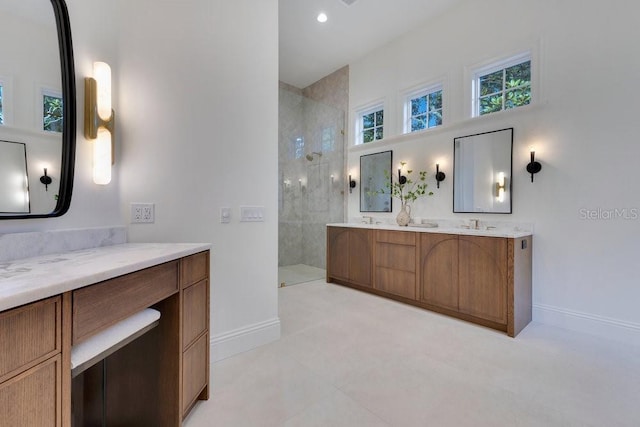 6186 Louise Cove Dr, Windermere, FL 34786 - bathroom featuring double vanity, walk in shower, and recessed lighting