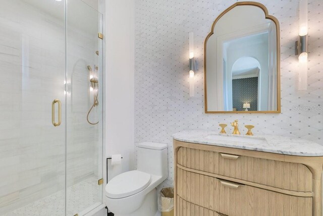 6186 Louise Cove Dr, Windermere, FL 34786 - full bathroom with vanity, a shower stall, and wallpapered walls