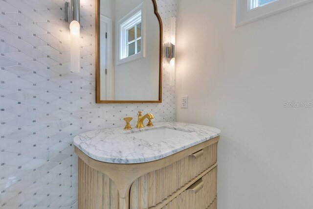6186 Louise Cove Dr, Windermere, FL 34786 - bathroom featuring vanity and plenty of natural light