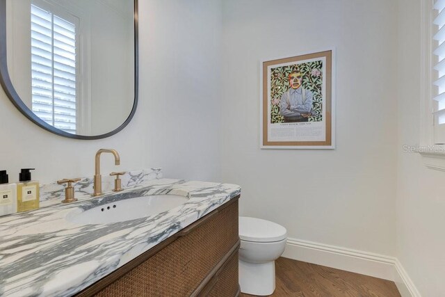6186 Louise Cove Dr, Windermere, FL 34786 - half bath with vanity and wood finished floors