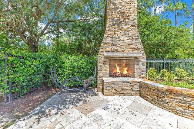6186 Louise Cove Dr, Windermere, FL 34786 - view of patio / terrace featuring an outdoor stone fireplace