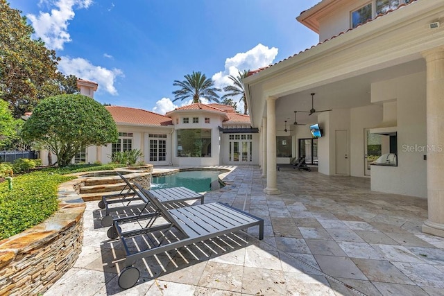 6186 Louise Cove Dr, Windermere, FL 34786 - view of patio featuring an in-ground hot tub, french doors, an outdoor pool, and ceiling fan