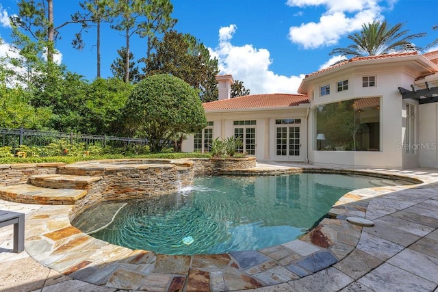 6186 Louise Cove Dr, Windermere, FL 34786 - view of swimming pool with french doors, a patio area, and a pool with connected hot tub