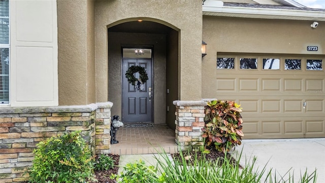 5723 Tarleton Way, Mount Dora, FL 32757 - entrance to property with stucco siding, stone siding, and a security system