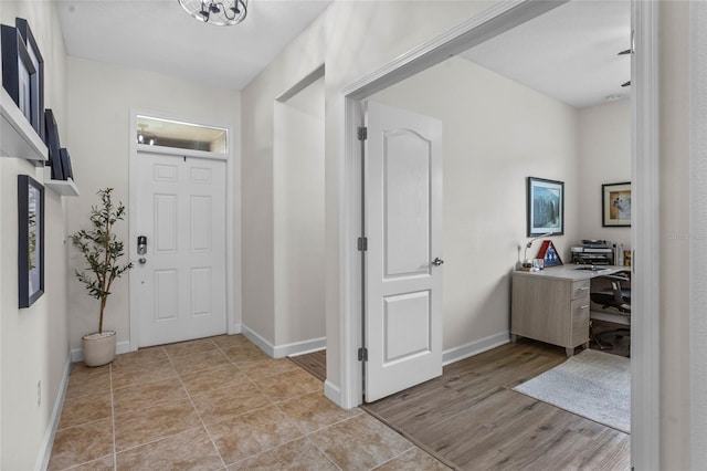 5723 Tarleton Way, Mount Dora, FL 32757 - foyer entrance with baseboards and light wood-style floors