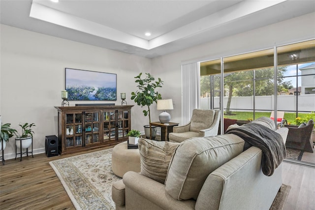 5723 Tarleton Way, Mount Dora, FL 32757 - living room with recessed lighting, wood finished floors, and a tray ceiling