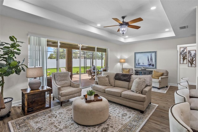 5723 Tarleton Way, Mount Dora, FL 32757 - living area featuring ceiling fan, wood finished floors, recessed lighting, and a raised ceiling