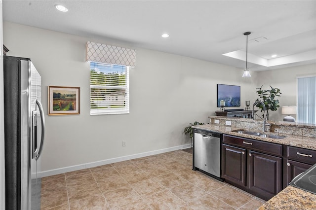 5723 Tarleton Way, Mount Dora, FL 32757 - kitchen with stainless steel appliances, dark brown cabinetry, pendant lighting, recessed lighting, and light stone countertops