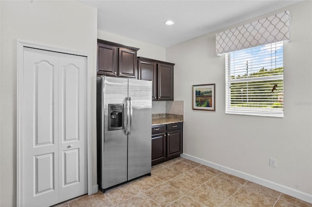5723 Tarleton Way, Mount Dora, FL 32757 - kitchen featuring stainless steel refrigerator with ice dispenser, dark brown cabinets, light stone counters, light tile patterned floors, and recessed lighting