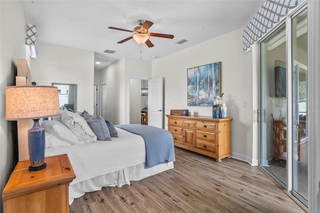 5723 Tarleton Way, Mount Dora, FL 32757 - bedroom with access to exterior, wood finished floors, and a ceiling fan