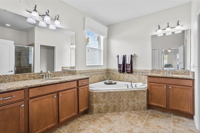 5723 Tarleton Way, Mount Dora, FL 32757 - bathroom with a stall shower, two vanities, tile patterned flooring, and plenty of natural light