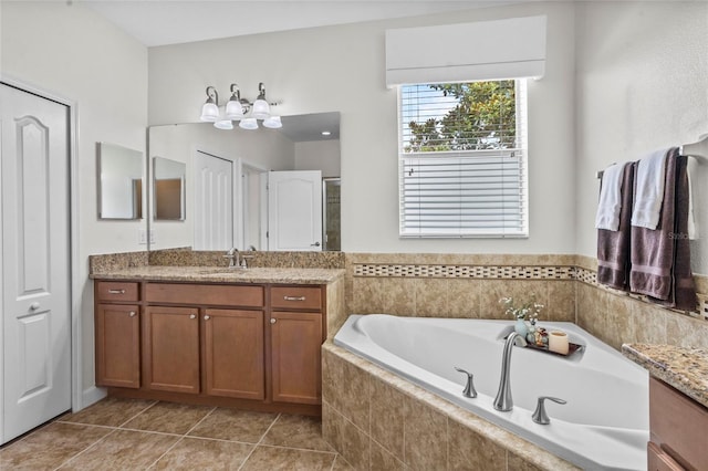 5723 Tarleton Way, Mount Dora, FL 32757 - bathroom featuring vanity, a garden tub, and tile patterned flooring