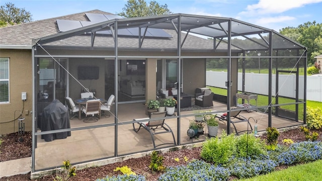 5723 Tarleton Way, Mount Dora, FL 32757 - back of property featuring a shingled roof, a patio area, a lanai, and stucco siding
