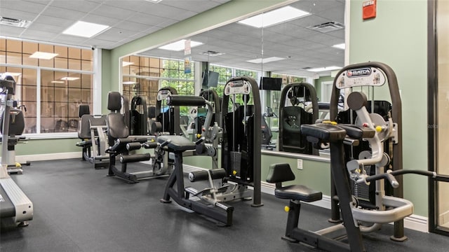 5723 Tarleton Way, Mount Dora, FL 32757 - exercise room featuring a paneled ceiling and baseboards