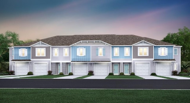3511 SE 37th Ct, Ocala, FL 34480 - townhome / multi-family property with a garage, driveway, and a lawn
