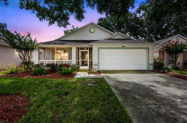 3707 Doune Way, Clermont, FL 34711 - ranch-style home with covered porch, stucco siding, driveway, and a garage