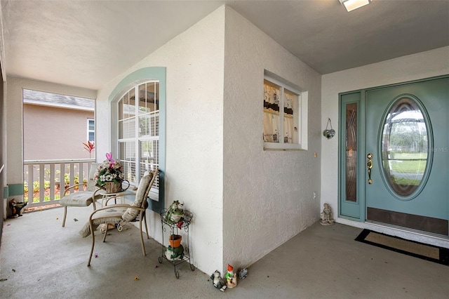 3707 Doune Way, Clermont, FL 34711 - doorway to property with covered porch and stucco siding