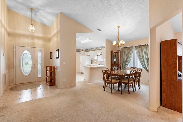 3707 Doune Way, Clermont, FL 34711 - foyer entrance featuring a chandelier, light colored carpet, plenty of natural light, light tile patterned floors, and lofted ceiling