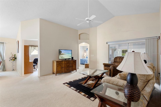 3707 Doune Way, Clermont, FL 34711 - living room featuring arched walkways, light colored carpet, a ceiling fan, and high vaulted ceiling