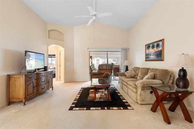 3707 Doune Way, Clermont, FL 34711 - living area with light colored carpet, arched walkways, a ceiling fan, high vaulted ceiling, and healthy amount of natural light