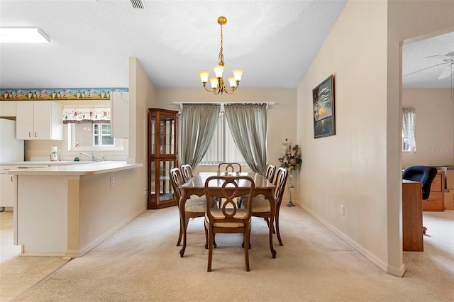 3707 Doune Way, Clermont, FL 34711 - dining area with a chandelier, light carpet, a ceiling fan, and a textured ceiling