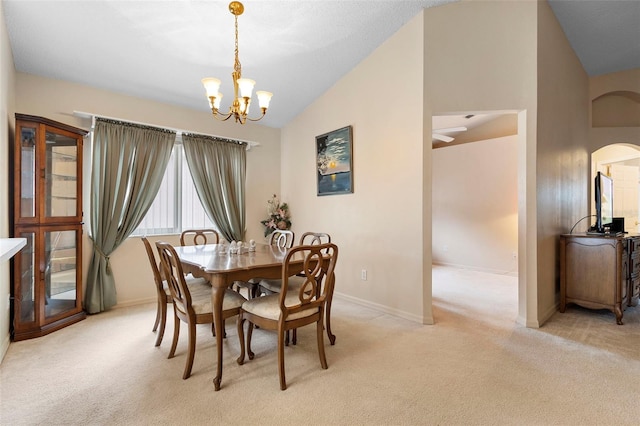 3707 Doune Way, Clermont, FL 34711 - dining room with lofted ceiling, light carpet, a chandelier, and arched walkways