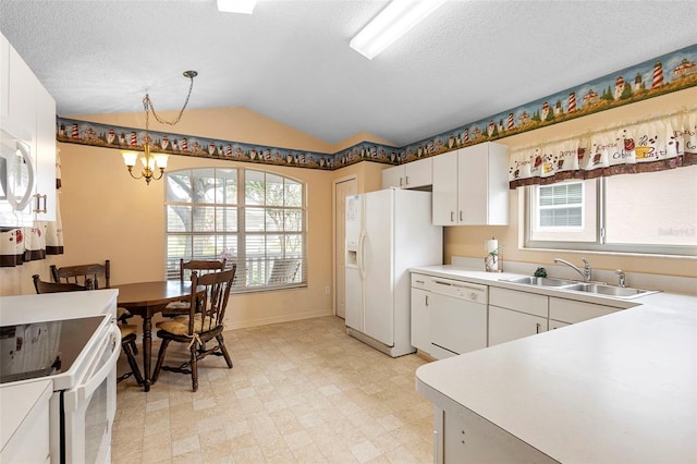 3707 Doune Way, Clermont, FL 34711 - kitchen with white appliances, a chandelier, light floors, vaulted ceiling, and plenty of natural light