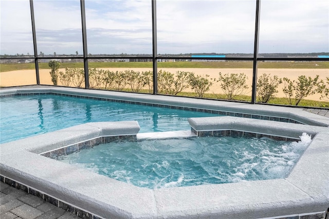 1907 Summer Dr, Davenport, FL 33897 - view of swimming pool featuring a pool with connected hot tub and glass enclosure