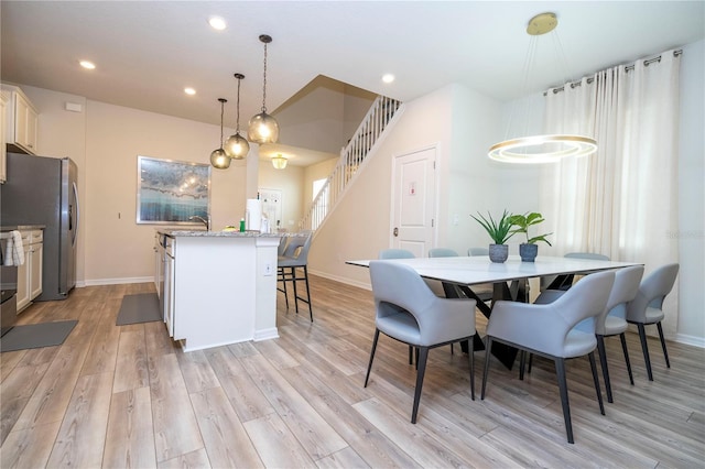 1907 Summer Dr, Davenport, FL 33897 - dining area featuring light wood-type flooring, recessed lighting, and stairway