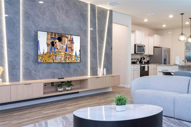 1907 Summer Dr, Davenport, FL 33897 - living area with light wood-type flooring and recessed lighting