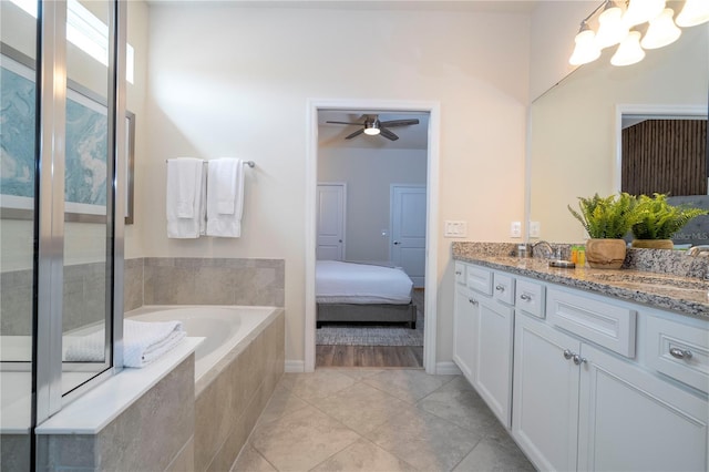 1907 Summer Dr, Davenport, FL 33897 - full bathroom with double vanity, a bath, a chandelier, tile patterned flooring, and ceiling fan