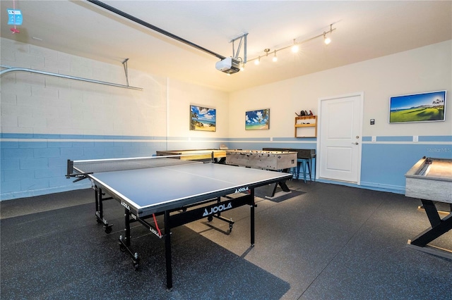 1907 Summer Dr, Davenport, FL 33897 - game room with dark flooring and concrete block wall
