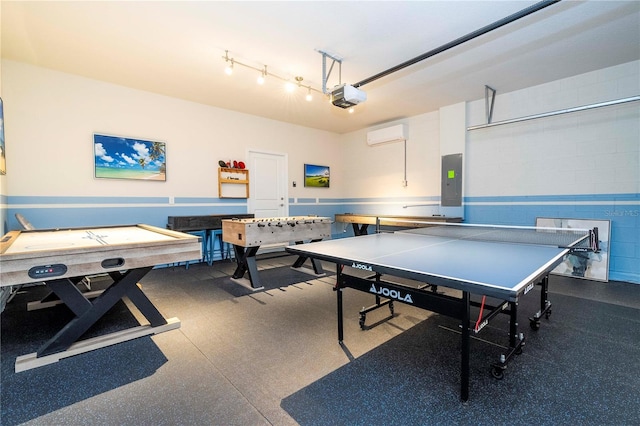 1907 Summer Dr, Davenport, FL 33897 - rec room featuring electric panel, a garage, rubber floors, and an AC wall unit