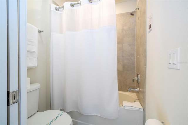 1907 Summer Dr, Davenport, FL 33897 - bathroom featuring toilet and shower / bathtub combination with curtain