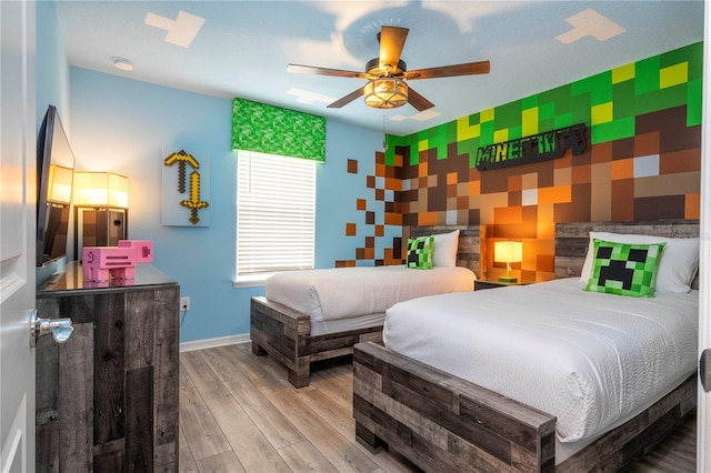 1907 Summer Dr, Davenport, FL 33897 - bedroom with an accent wall, wood finished floors, wallpapered walls, and ceiling fan