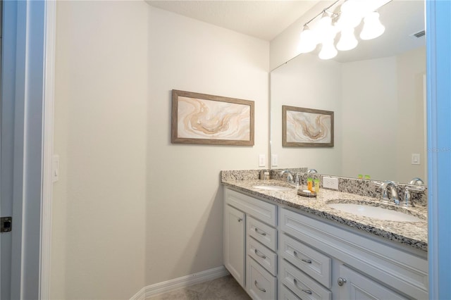 1907 Summer Dr, Davenport, FL 33897 - bathroom featuring double vanity and a chandelier