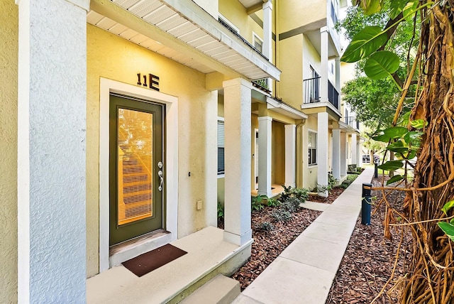 11 W Harding St Unit E, Orlando, FL 32806 - view of exterior entry with stucco siding