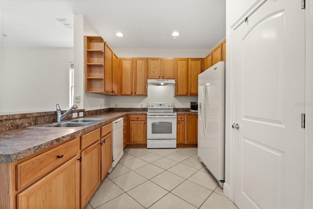 11 W Harding St Unit E, Orlando, FL 32806 - kitchen with white appliances, open shelves, under cabinet range hood, dark countertops, and light tile patterned floors