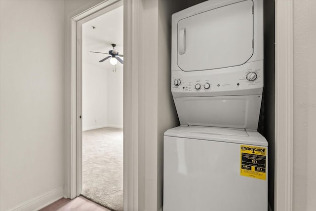 11 W Harding St Unit E, Orlando, FL 32806 - washroom featuring stacked washer / dryer and a ceiling fan