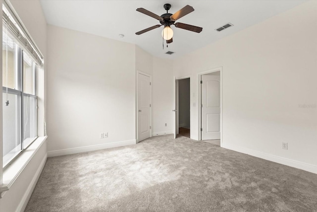 11 W Harding St Unit E, Orlando, FL 32806 - unfurnished bedroom with light carpet and a ceiling fan