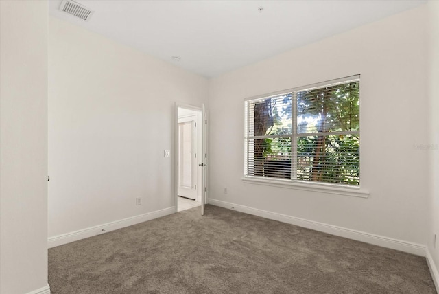 11 W Harding St Unit E, Orlando, FL 32806 - carpeted spare room featuring baseboards