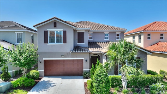 8020 Oak Shadow Ct, Davenport, FL 33837 - mediterranean / spanish house featuring a tiled roof, stucco siding, and concrete driveway