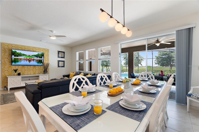 8020 Oak Shadow Ct, Davenport, FL 33837 - dining room with ceiling fan and light tile patterned floors