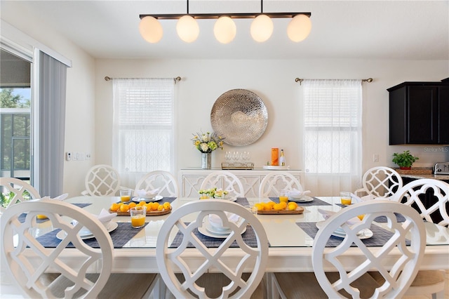 8020 Oak Shadow Ct, Davenport, FL 33837 - dining room featuring healthy amount of natural light