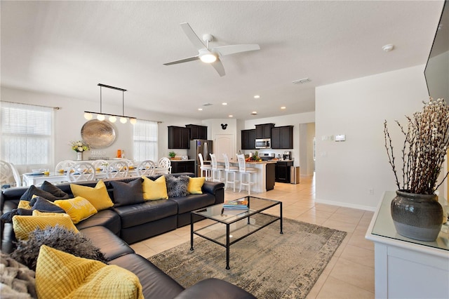8020 Oak Shadow Ct, Davenport, FL 33837 - living room featuring light tile patterned flooring and a ceiling fan